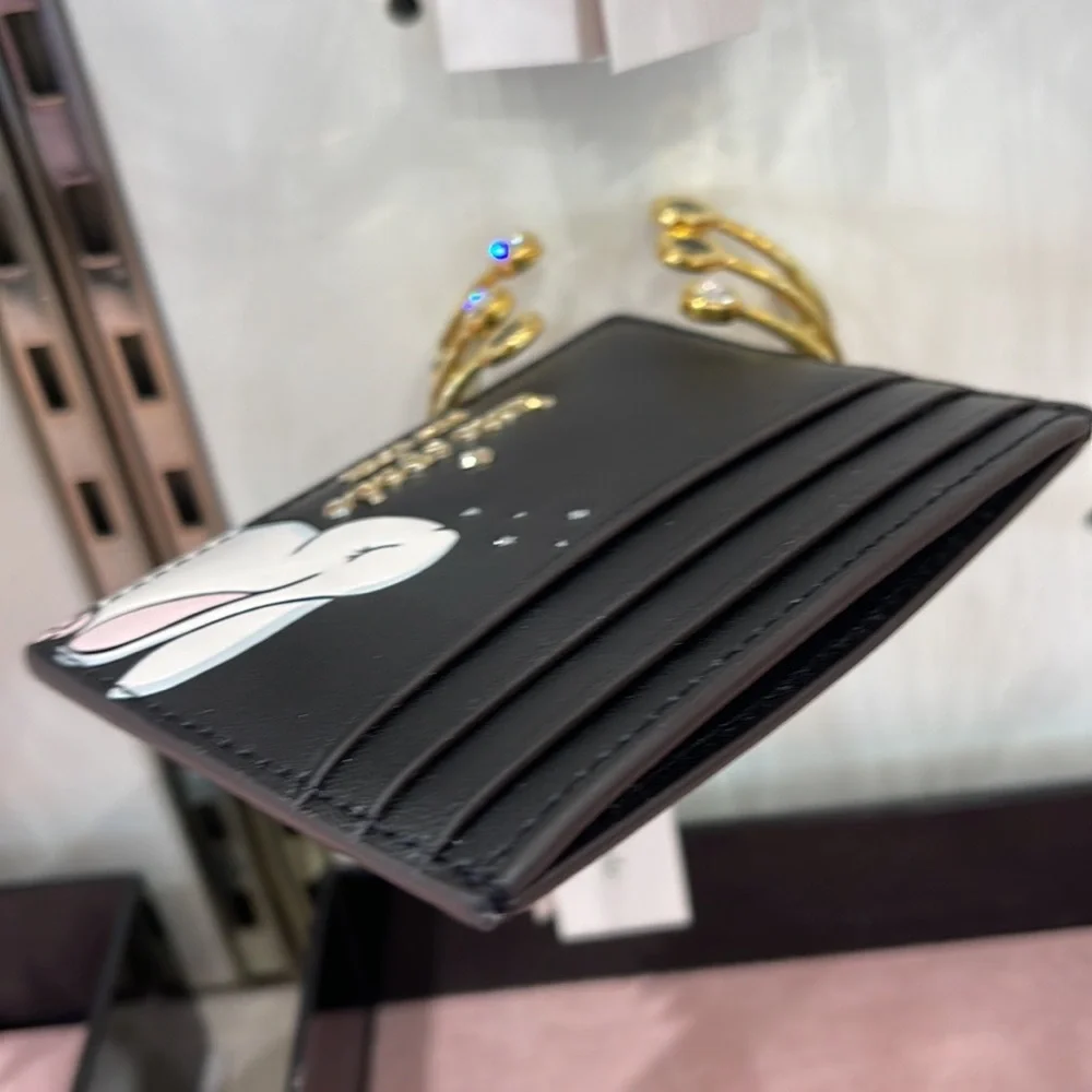 Kate Spade Bunbun Bunny Small Slim Card Holder Wallet

COLOR:
Black Multi
NWT - Picture 16 of 16